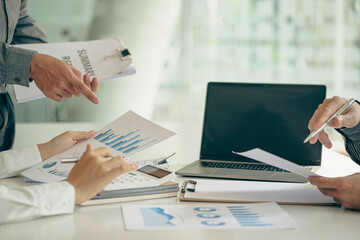 Business team analyzing data using computer while spending time in office Financial planning, strategy and brainstorming with Financial Accounting Concept Colleagues