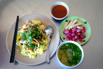 Close-up photo of Tam Ky chicken rice plate. This is a famous delicious rice dish in Vietnam