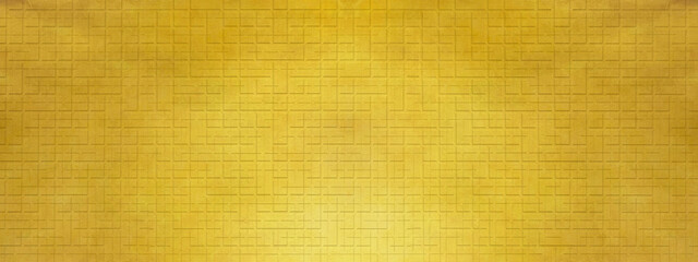 金のモザイクタイルの壁　建材のテクスチャ素材