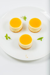 Creamy petite mango cheesecake with mango jelly and a wholewheat biscuit crumb base.