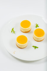 Creamy petite mango cheesecake with mango jelly and a wholewheat biscuit crumb base.