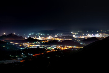 Panorama of the coastal city of Nha Trang, Vietnam at night. View from the high mountain