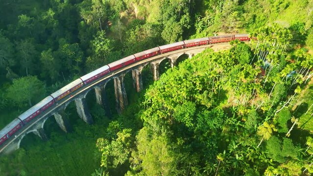 Drone Sri Lanka 4k. Train on Nine Arches Bridge. Scenic railway route Kandy to Ella, tea plantations. South Asia summer tourism.