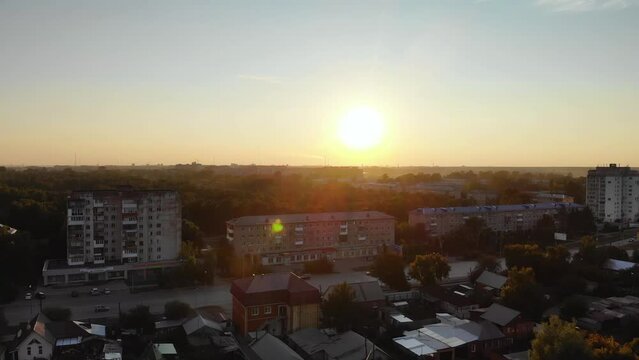 omsk flying over buildings inresidential district sunset , amur 