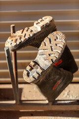 Miners boots on a rack at a mine site in Australia