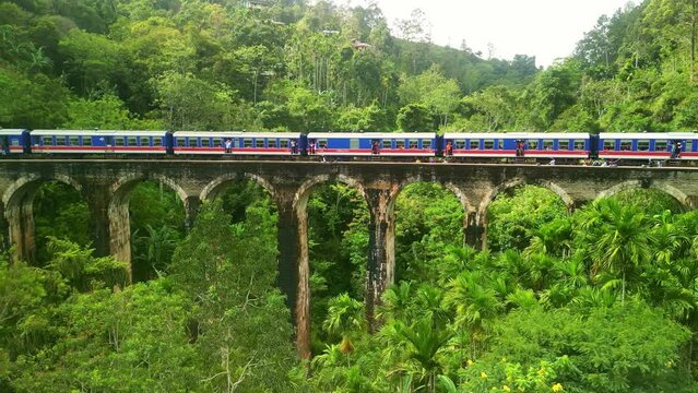 Drone Sri Lanka 4k. Train on Nine Arches Bridge. Scenic railway route Kandy to Ella, tea plantations. South Asia summer tourism.