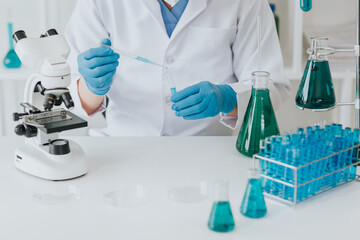 Fototapeta premium Medical research laboratories: young scientists in advanced science laboratories for medicine. biotechnology microbiology
