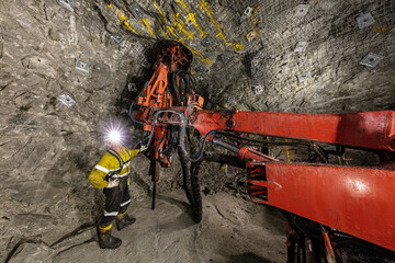 Miners underground inspecting work in progress at a mine site in Australia