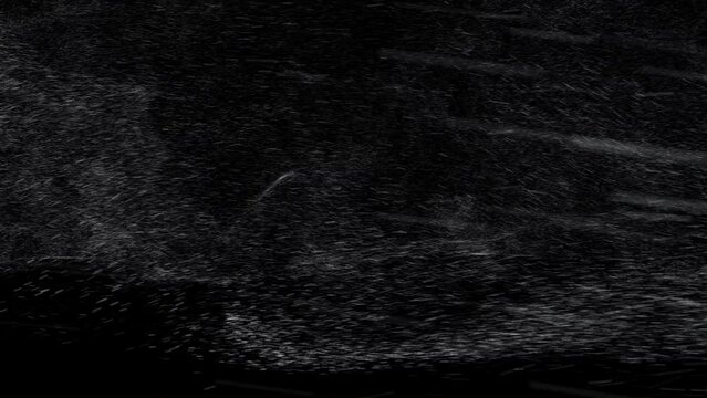 windy Dense 4K Arctic rainy snowstorm swirling against black. Blizzard element. Dense heavy blizzard snowstorm VFX insert. Black screen Christmas snowstorm. Snow wind. Practical snow. Weather effects.