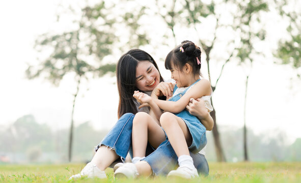 image of mother and daughter playing in the park