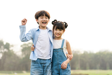 image of brother and sister having fun in the park