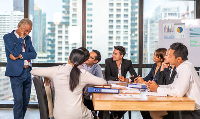 Group of asian business meeting and discussing strategy startup project analysis finance process.Success asian business management work plan and brainstorm marketing idea in office.Teamwork