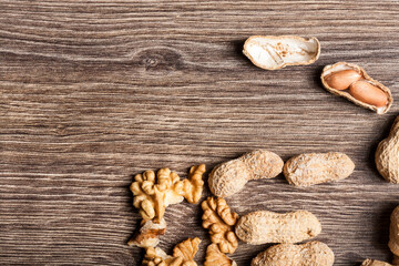 Nuts on wooden background in close up photo
