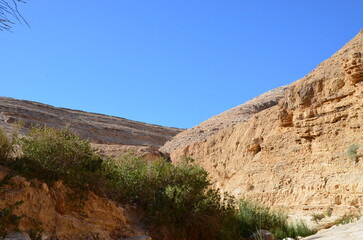 Fototapeta na wymiar Panoramic view of the beautiful mountains, rocks and canyons of Wadi Ghweir in the Jordan desert