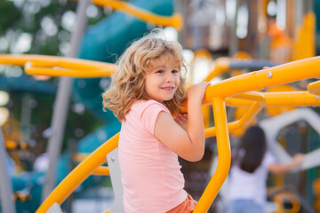 Happy kids having fun on playground. Adorable little child boy having fun on playground.