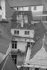 Vertical grayscale view of the historic buildings in the Old Town of Prague, Czech Republic