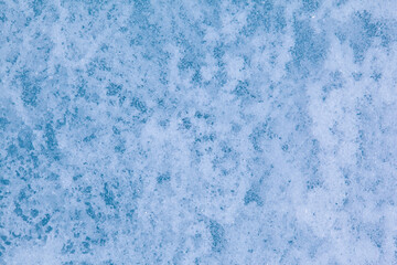 Texture of winter ice surface. Blue natural ice background