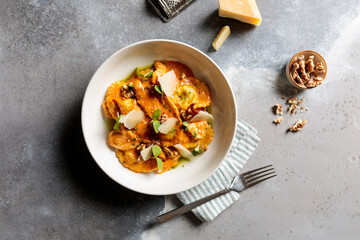 Rose Ravioli with walnuts served in dish isolated on table top view of arabic breakfast