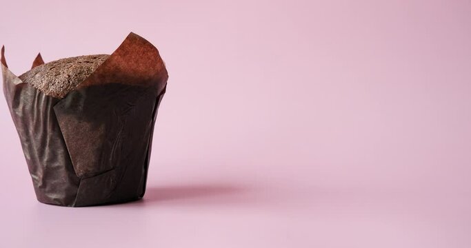 Chocolate muffin close-up. 4K stop motion animation
