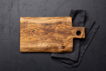 Wooden cutting board and kitchen towel