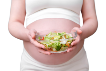 Pregnant woman with a bowl of salad in her hands, isolated on a white background