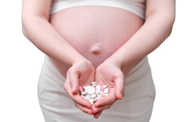 Pills in the hands of a pregnant woman, a studio photo, isolated on a white background