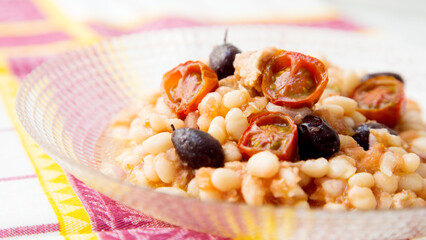 Delicious and healthy white bean salad with cod and black olives.