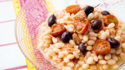 Delicious and healthy white bean salad with cod and black olives.