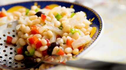 Delicious and healthy white bean salad with cod and black olives.