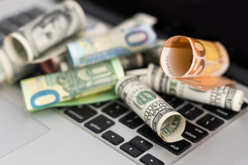 Fototapeta premium Money on computer keyboard. roll