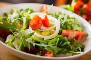 Delicious avocado salad with fresh tomatoes.
