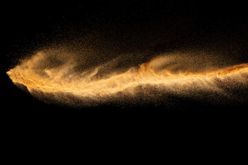 Fototapeta na wymiar Brown colored sand splash.Dry river sand explosion isolated on black background.
