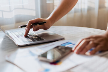 Hands typing messages on laptop keyboard chatting friends searching information from internet while working on computer concept for technology devices contact business people