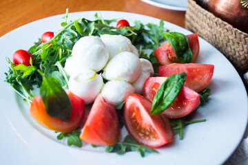 Burrata salad. The burrata is a fresh cow's milk cheese, with spun paste and round in shape, with an external appearance similar to that of mozzarella 