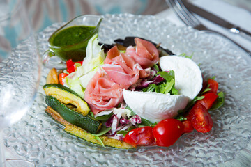 Burrata salad. The burrata is a fresh cow's milk cheese, with spun paste and round in shape, with an external appearance similar to that of mozzarella 