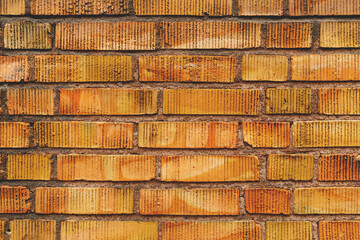 Yellow clinker brick wall texture, detail from streets of Halmstad in Sweden