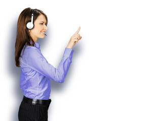 Call center service. Profile side image of customer support phone sales operator in blue cloth, headset show pointing clicking at copy space, imaginary or text, isolated white background.