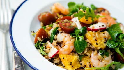 Delicious rice salad with prawns and spinach