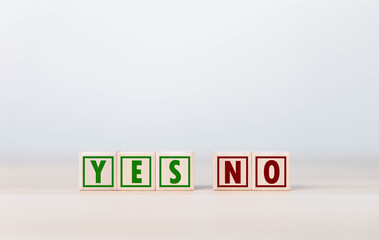 The wooden block shows yes or no letters.	
