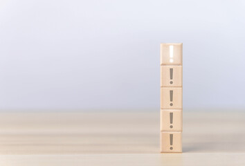 The wooden block shows an exclamation mark.	
