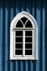 Mosque window. Muslim architecture. Peeling paint religious building. Oriental arch. Blue wooden mosque. 