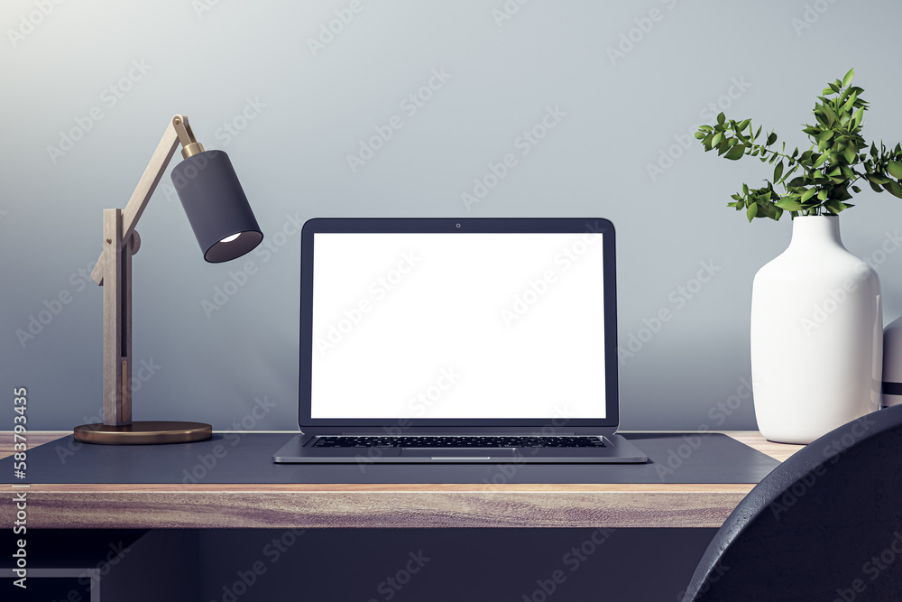 Poster close up of empty white laptop on wooden desk with decorative vase and plant, lamp and mock up place