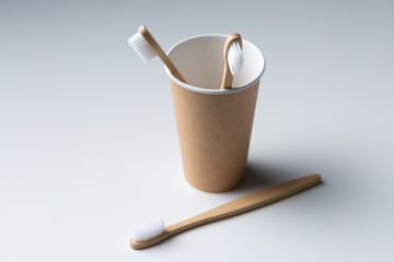 Toothbrush in a cardboard ecological cardboard cup, hygiene health care.