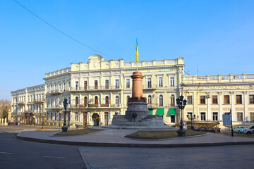 Fototapeta na wymiar Ukrainian flag at the place former Monument to the Empress Catherine in Odessa, Ukraine