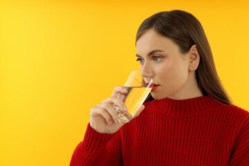 Concept of people, young woman on yellow background