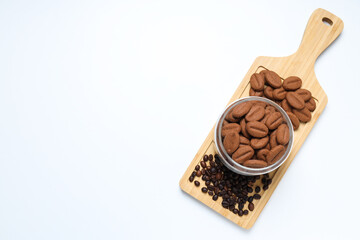 Concept of tasty snack for hot drink - cookies in the shape of coffee seeds