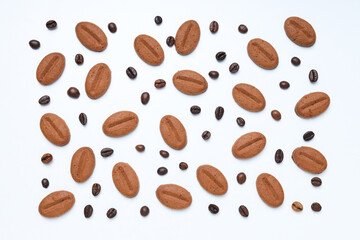 Concept of tasty snack for hot drink - cookies in the shape of coffee seeds
