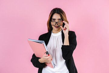 young hispanic business woman holding folders and graphics on pink background in Mexico Latin America