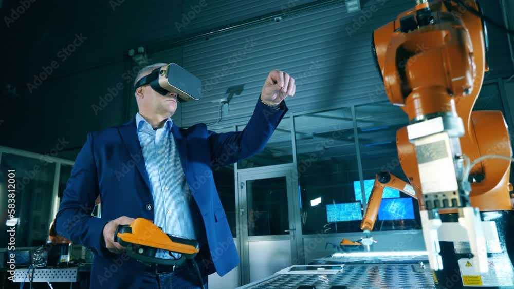 Wall mural robotic mechanism is being virtually controlled by a researcher