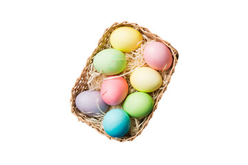 Basket of colorful Easter eggs isolated on white background. Easter basket filled with colored eggs top view holiday concept